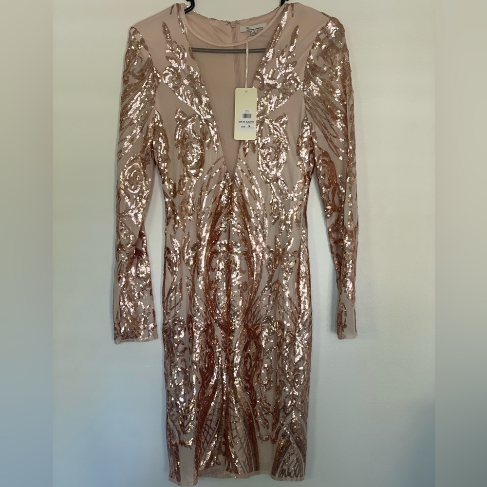 New with tags. Beautiful V neck dress.